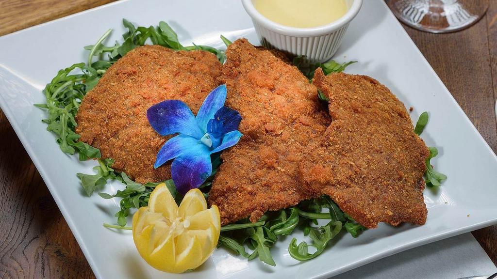 Veal Milanese · Breaded veal cutlet, pan-fried and served with lemon wedges. Served with side salad, your choice of pasta or roasted potatoes and vegetables.