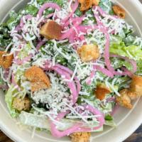 Vegetarian Caesar Salad · A vegetarian caesar salad with crispy fresh romaine, red pickled onions, shredded provolone,...