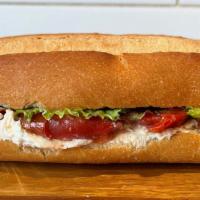 G Tom Sandwich · This seasonal sandwich features refreshing pickled herb-y green tomatoes, with a kick of chi...