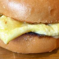 Eggs & Cheese With Choice Of Meat · Scrambled eggs & cheddar on a Caputo's white bun. Options to add delicious ham, or bacon.