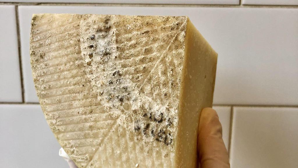 Manchego 1605 · 1/4 lb - Made from the milk of a single herd of Mancha sheep, whose feed is also grown on the farm, this famed cheese is perfectly aged in an unwaxed rind which allows just the right amount of moisture to escape. This creates a crumbly-melt-in-your-mouth texture. The flavor is grassy and nutty with just the right amount of salt. Enjoy with tapas on some Spanish ham, fresh fruit, or nuts.