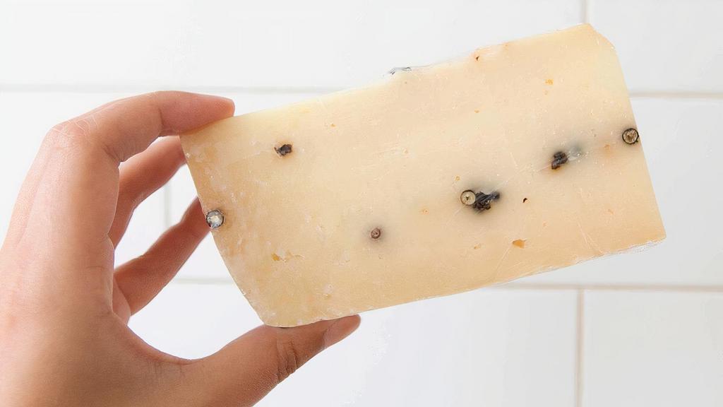 Gran Pepe · A pecorino style cheese with black peppercorns. 1/4 pound, pasteurized sheep's milk