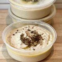 Hummus With Tahini · 8 oz. container of Ground chickpeas, Soom Egyptian single-origin Tahini, Olive Oil, Cumin, L...