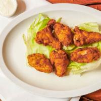 Original Chicken Wings (6 Pcs.) · Fresh and juicy chicken wings served with celery sticks and Bleu cheese dressing.
