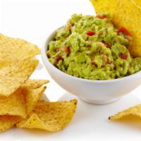 Guacamole & Chips · House-made fresh guacamole served with warm and crispy tortilla chips.