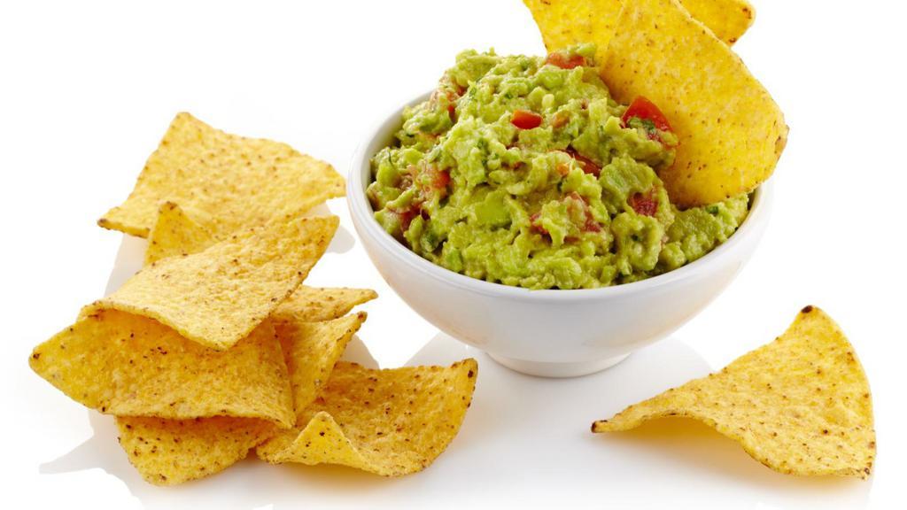 Guacamole & Chips · House-made fresh guacamole served with warm and crispy tortilla chips.