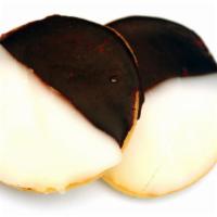 Jumbo Black & White Chip Cookie · A la mode - vanilla. Fresh baked large cookie dipped in white chocolate and milk chocolate.