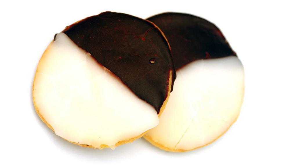 Jumbo Black & White Chip Cookie · A la mode - vanilla. Fresh baked large cookie dipped in white chocolate and milk chocolate.