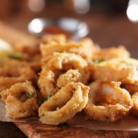 Fried Calamari · Flash-fried squid golden on the outside and perfectly chewy on the inside. Served with a squ...