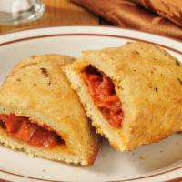 Chicken Pizza Roll
 · Delicious pizza roll stuffed with breaded chicken strips, fresh mozzarella, and homemade tom...
