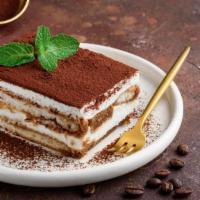 Homemade Tiramisu · Delicate coffee dipped lady fingers, layered with a creamy mascarpone filling and a hint of ...