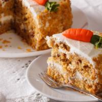 Carrot Cake · Moist carrot cake topped with a delicious cream cheese frosting and cinnamon.