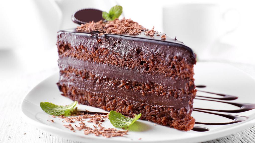 Chocolate Cake · Deep, dark, moist chocolate cake layered and topped with creamy, chocolate frosting.