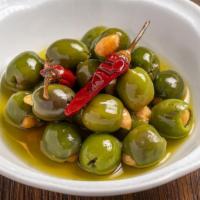 Warm Marinated Olives · Stuffed with Marcona Almonds
