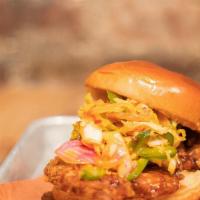 Hot Honey Chicken Sandwich · Hot honey glazed fried chicken, on brioche, with pickled cabbage and mayo.