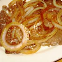 Steak With  Sauteed Onions / Platillo Bisteck Encebollado  · ACCOMPANIED BY TWO HANDMADE TORTILLAS AT THE TIME OF YOUR ORDER WITH YELLOW RICE RED BEANS A...