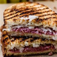 House-Made Pastrami Reuben · A classic: house-made pastrami, sauerkraut, Swiss, & Russian dressing on griddled rye br...