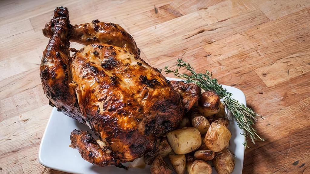 Half Chicken W/ Side · Our famous dry-brined, locally-raised, Rotisserie Chicken. Seasoned with salt, pepper, paprika, marjoram, thyme & sage. 

Choose from our delicious house-made sides to complete your meal.