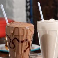 Chocolate Shake · Our vanilla soft serve mixed with house-made chocolate sauce. If dining in, for a special tr...