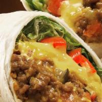 Beef Burrito · 12 inch flour tortilla with beans, rice, cheddar jack cheese, sour cream, lettuce, and tomat...