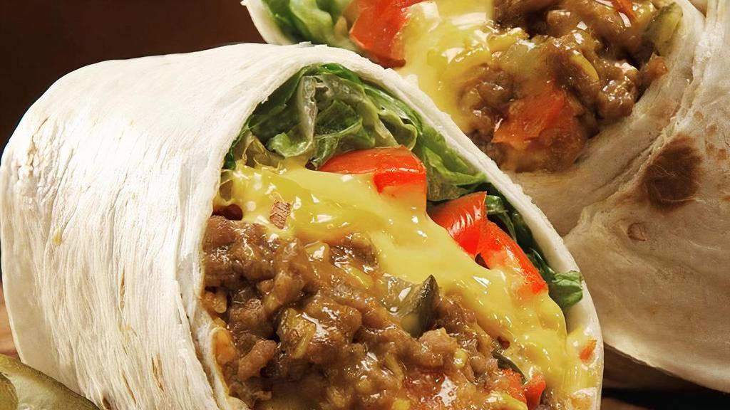 Beef Burrito · 12 inch flour tortilla with beans, rice, cheddar jack cheese, sour cream, lettuce, and tomatoes.