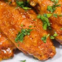 Sweet Mango Bbq Wings · Seven pieces. Flavorful classic and deep fried bone in wings tossed in sweet mango BBQ sauce.