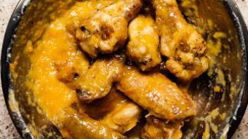 Mango Pineapple Wings (7 Pieces) · Flavorful classic and deep fried bone in wings tossed in mango pineapple sauce.