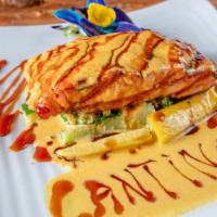Grilled Salmon · Grilled salmon topped with shrimp bisque sauce served with steamed vegetables and garlic mas...