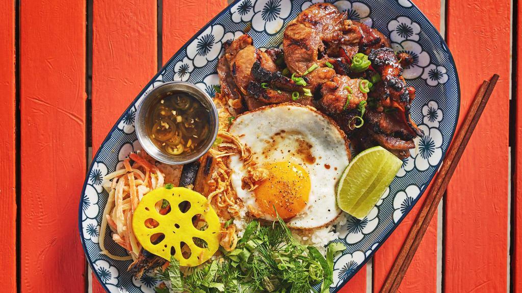 Blazed And Glazed · Charred Berkshire pork shoulder that’s been slathered in a mouth watering honey glaze, with a fried egg, pickle slaw, fermented chili vinaigrette and herb bomb over broken rice.  Gluten-free.
