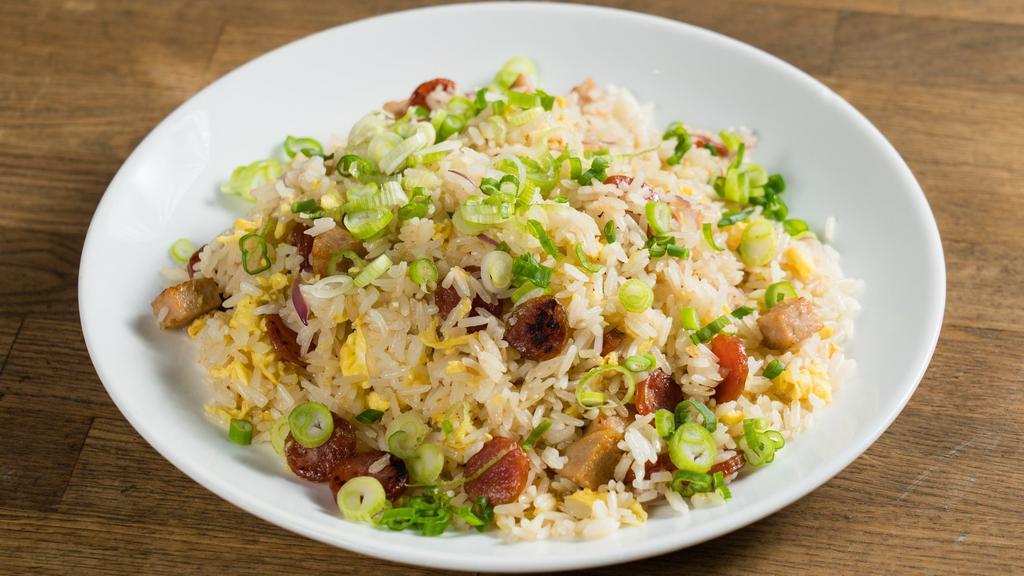 Dad'S Fried Rice · Because Papa Tran knows best. Vietnamese mortadella, Chinese sausage, fluffy egg, charred onion. Hangover heaven! Gluten-free.