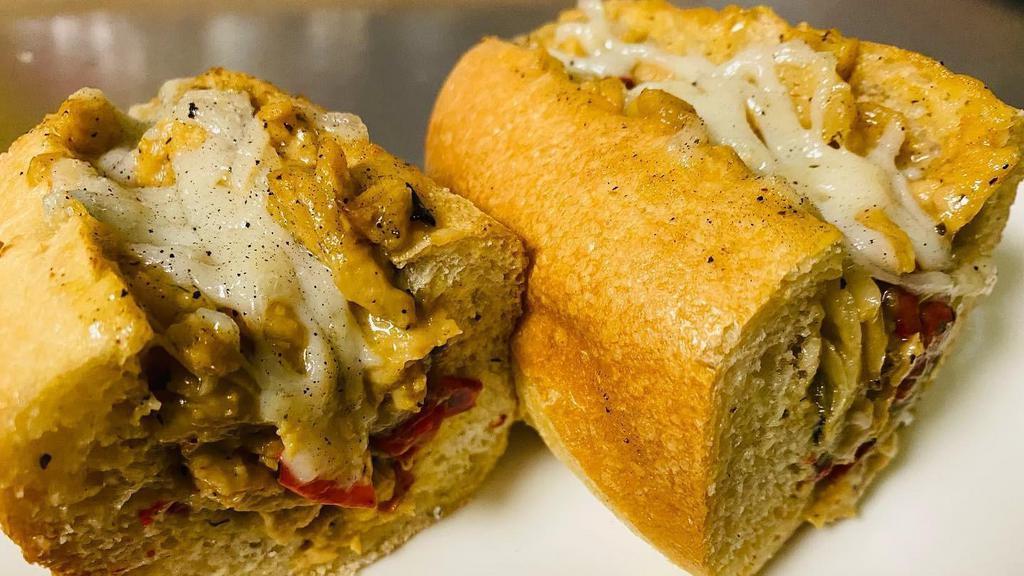 Chicken Cheesesteak Sub · Vegan chicken with cheese, peppers and onions served on a long sub roll. 100% vegan