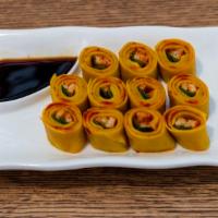 Sushi Lhamo · chive & tofu rolled in layers of noodle flour