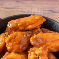 Buffalo Mild Bone-In Wings · Served with celery or carrots, and blue cheese or ranch.