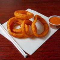 Onion Rings · Thick battered crispy onions.