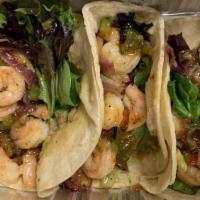 Shrimp Tacos · Three shrimp tacos filled with spinach and pico De gallo.