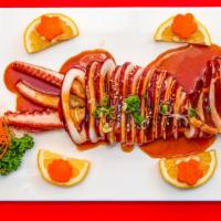 Squid · Tender grilled squid topped with chef special sauce.