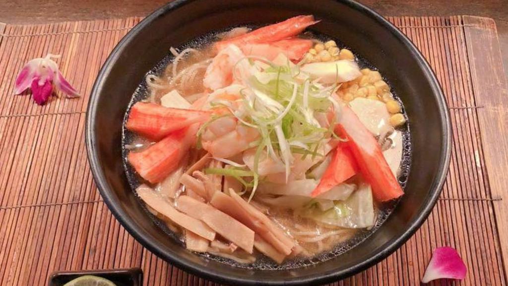 Seafood Ramen · Shrimp, kani, scallop and king mushroom with a soy sauce and vegetable based soup broth and garlic oil.