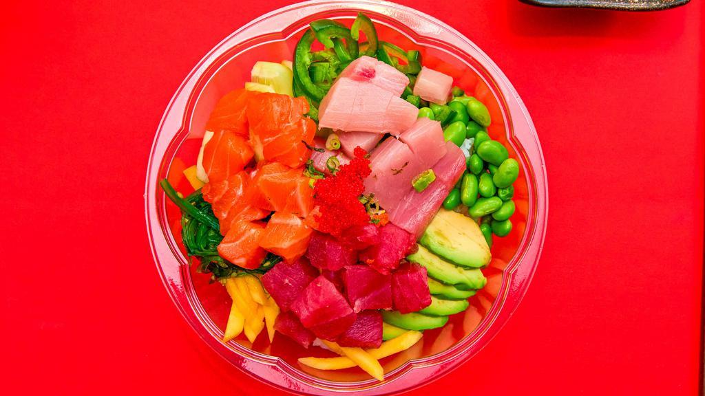 Poke Rainbow · Tuna, salmon, yellowtail, seaweed salad, edamame, mango, cucumber, furikake, green onion, avocado, kizami nori, tobiko and jalapenos.