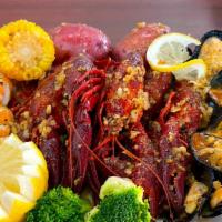 The Cajun Boil · 1/2 lb shrimp head off, 1/2 lb craw fish, and 1/2 lb black mussel. Come with corn and potato...