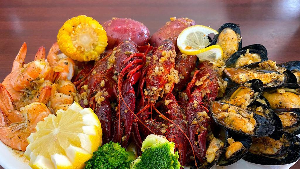 The Cajun Boil · 1/2 lb shrimp head off, 1/2 lb craw fish, and 1/2 lb black mussel. Come with corn and potatoes.