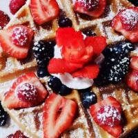 Berry Waffle Breakfast · Belgian waffle topped with fresh berries, whipped cream and powdered sugar.