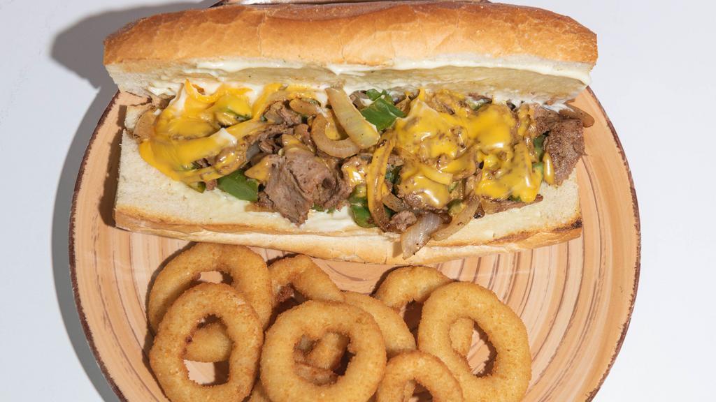 Philly Cheese Steak On A Hero · Steak, with cooked onions and peppers, mayo all in a hero bread.