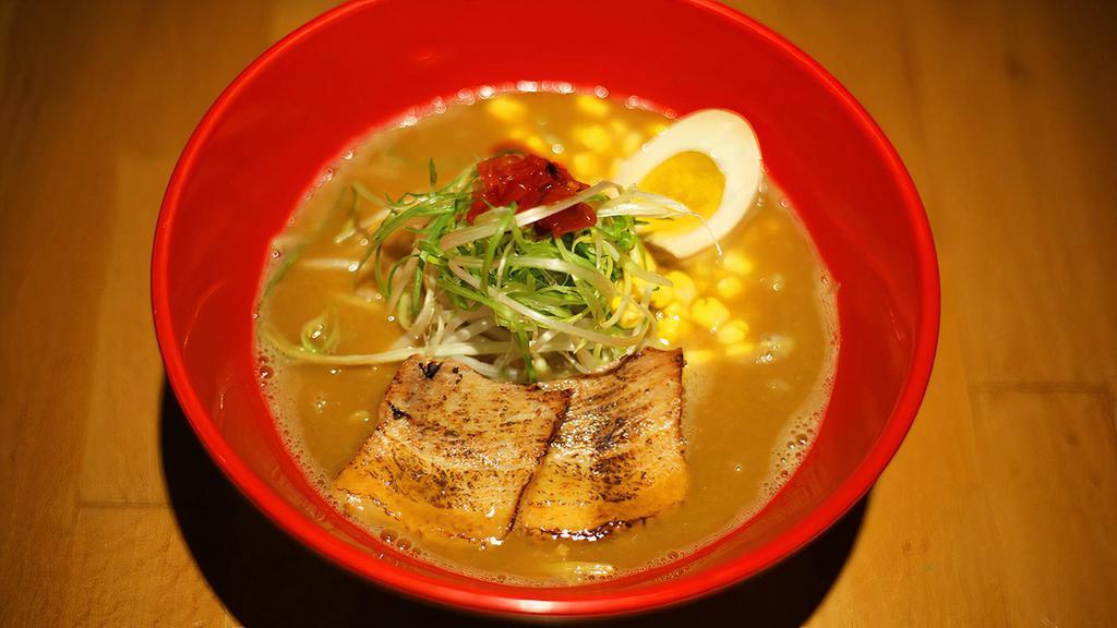 Curry Paitan · Our Chicken Paitan with our special curry sauce. Loaded with bean sprouts, scallions, corn, FUKUJINZUKE (red pickles), a half of seasoned boiled egg & Char Siu (sliced meat).