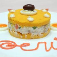 Causa Rellena · Layered cold mashed potatoes with choice of protein.
