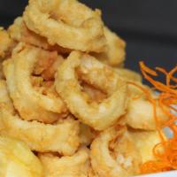 Chicharron De Calamares · Fried calamari rings, comes with fried yucca sticks and mayo