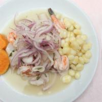 Ceviche Mixto · Raw fish and shellfish marinated in lime juice, red onions, blend of spices, and hot peppers.