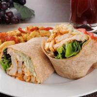 The Buffalo Chicken Wrap · Delicious wrap made with seasoned chicken tenders, lettuce, sliced tomatoes, radioactive sau...