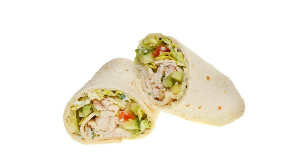 The Chicken Caesar Wrap · Delicious wrap made with grilled chicken, shredded lettuce, sliced tomatoes, parmesan cheese, and a Caesar dressing.