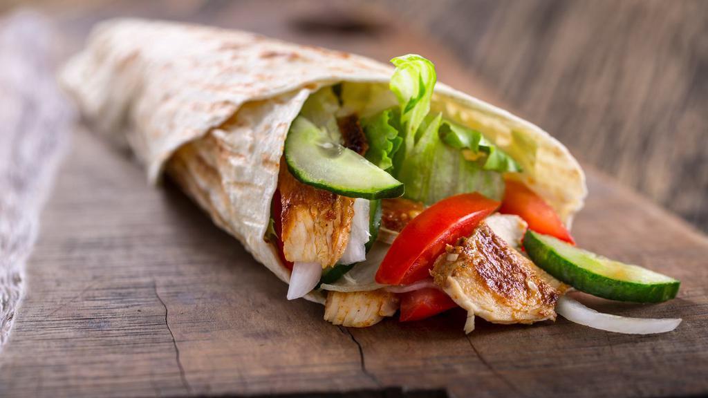 The Chicken Tender Wrap · Delicious wrap made with seasoned chicken tenders, shredded lettuce, sliced tomatoes, onions, and a choice of sauce.