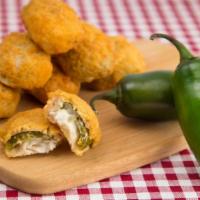Jalapeño Poppers · Golden-fried jalapeños stuffed with cheddar cheese, served with a ranch dressing.